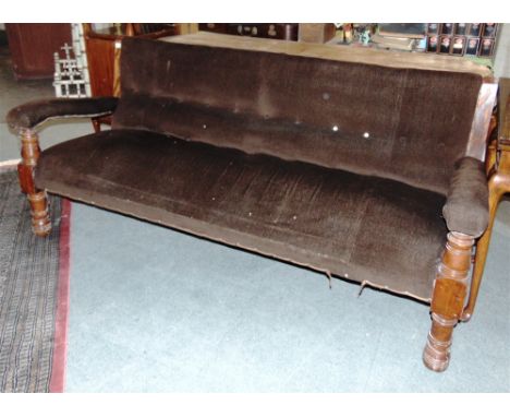 A LONG VICTORIAN UPHOLSTERED BUTTON BAY BENCH  with open armrests and on turned frontal supports, width 184cm, depth 64cm, he