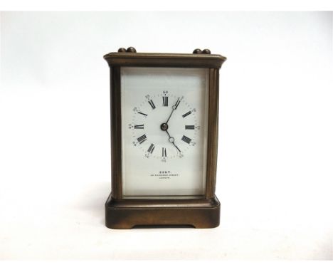 A BRASS CASED CARRIAGE CLOCK  the enamel dial inscribed 'DENT 33 COCKSPUR STREET LONDON', 9cm wide 8cm deep 14cm high
