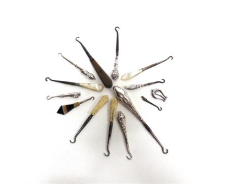 A COLLECTION OF FOURTEEN GLOVE BUTTON HOOKS in various metals, some silver