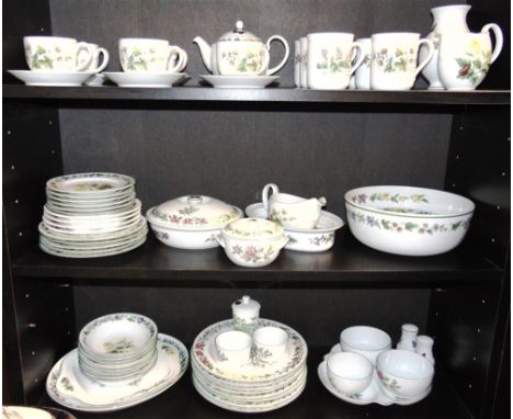 AN EXTENSIVE ROYAL WORCESTER DINNER SERVICE  in the 'Worcester Herbs' pattern, comprising 8 dinner plates, six mugs, tea pot,