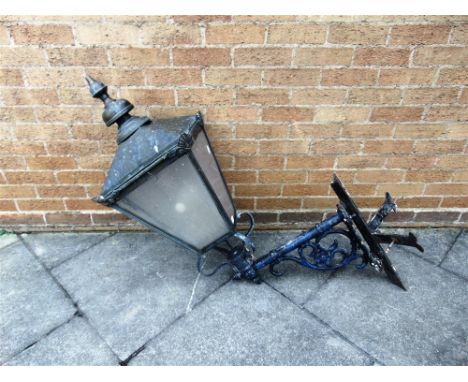 A LARGE VICTORIAN STREET LIGHT STYLE EXTERIOR LANTERN  with bracket for fixing to a corner wall, 110cm high 60cm projection f