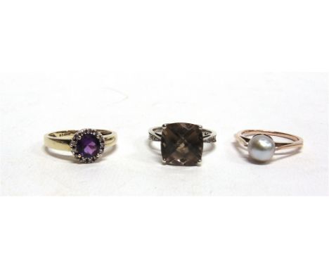 AN AMETHYST AND SINGLE CUT DIAMOND 9 CARAT GOLD CLUSTER RING finger size O; a smoky quartz 9 carat white gold ring, with diam