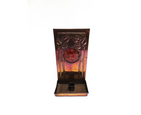 AN ARTS &amp; CRAFTS COPPER CANDLE HOLDER with Ruskin type enamel roundel and embossed foliate decoration, apparently unmarke