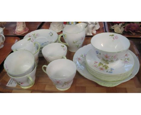 21 piece Shelley fine bone china 'Wild Anemone' 13977 tea service. (B.P. 24% incl. VAT) CONDITION REPORT: Grubby with brown s