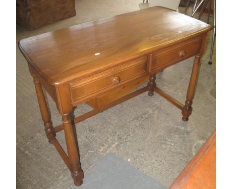 Elm Ercol two drawer side table with gold label. (B.P. 24% incl. VAT)