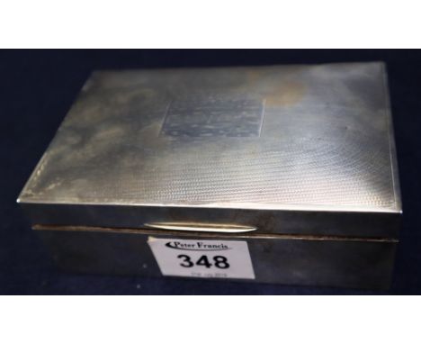 Silver engine turned cigarette case of rectangular form, the interior revealing two wooden sections. (B.P. 24% incl. VAT)