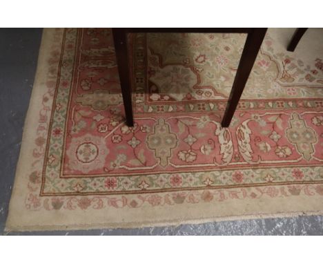Large rug on a cream ground with floral borders and panel to the interior. (B.P. 24% incl. VAT)