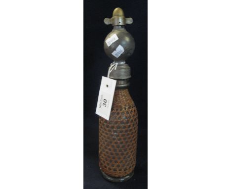 Vintage soda syphon with wicker cover. (B.P. 24% incl. VAT)