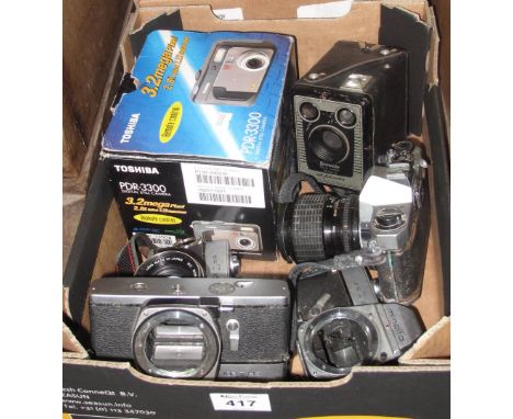 Box of assorted cameras to include; Minolta SRT 201 x 3, Toshiba digital camera, Brownie model D camera etc. (B.P. 24% incl. 