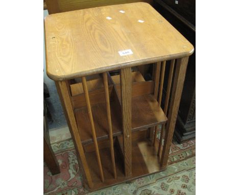 Elm Ercol style revolving bookcase. (B.P. 24% incl. VAT)