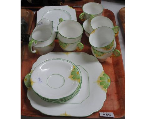 21 piece Aynsley bone china tea service on a white porcelain ground with flower head handles. (B.P. 24% incl. VAT) CONDITION 