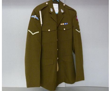 British Army dress uniform khaki green jacket with label penned "Walker 25116141" having Royal Horse Artillery collar badges,