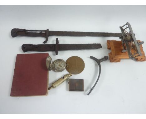 Mixed bag of excavated bayonets, WW I compass dated 1918, model bi-plane made from a spark plug. Whistle dated 1916, small Fr