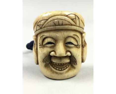 TWO JAPANESE IVORY NETSUKE,Meiji period, each modelled as a Noh mask, one signed, each 3.8cm high (2)