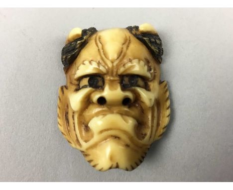 JAPANESE IVORY NETSUKE,Meiji period, modelled as a Noh mask, signed, 3.5cm high