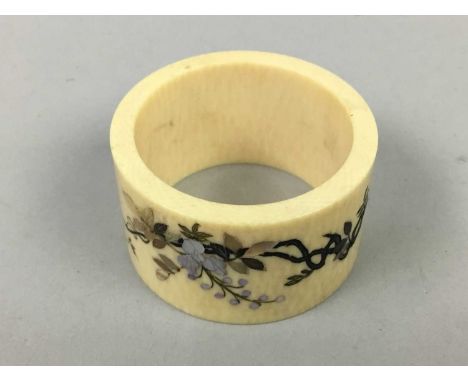 JAPANESE IVORY AND SHIBAYAMA NAPKIN RING,inlaid with mother of pearl and incised floral decoration, 5cm diameter