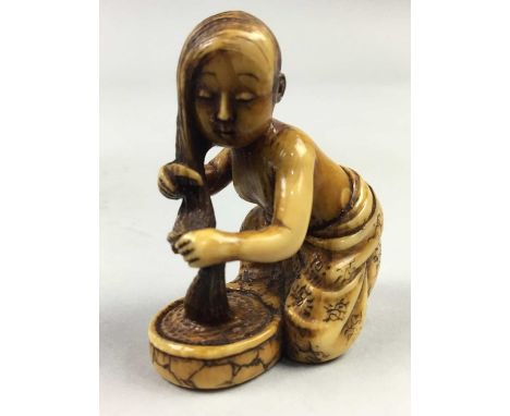 JAPANESE IVORY NETSUKE,Meiji period, depicting a woman washing her hair, 4cm high