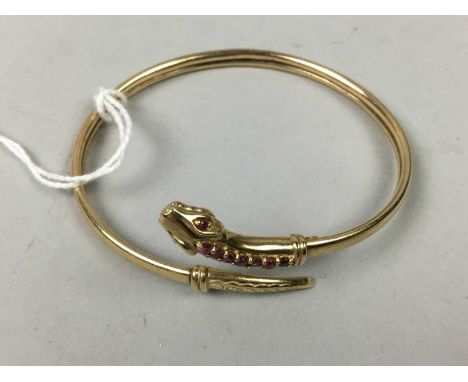 NINE CARAT GOLD SNAKE BANGLE,set with ameythst coloured stonesAcid stain present, outside of the bracelet scratched, stones o