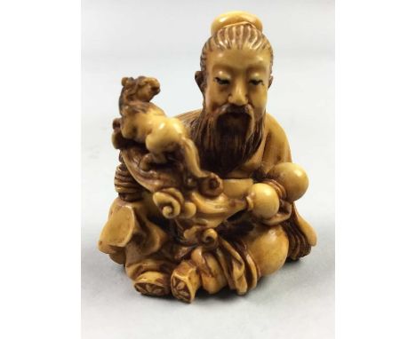 JAPANESE IVORY NETSUKE,Meiji period, depicting a seated figure with mythical horse, signed, 4cm high