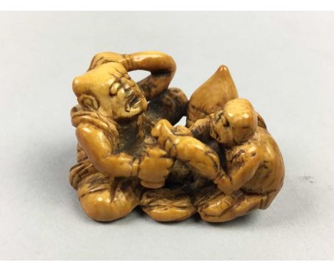 JAPANESE IVORY NETSUKE,Meiji period, depicting a group of two figures, 4cm long