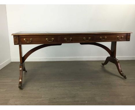 REPRODUCTION LIBRARY TABLE, with green leather skiver, 170cm wide, along with an armchair and a library style table lamp (3)