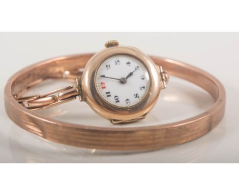 Twelve gold rings, wrist watch and bangle, 9 carat yellow gold slave bangle approximate weight 8gms, a 9 carat gold wrist wat