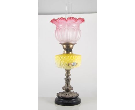 Victorian oil lamp, with cranberry shade, height 63cm.