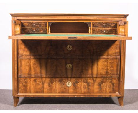 A Continental walnut secretaire chest, probably German late 19th Century with rounded corners, secretaire drawer well fitted 