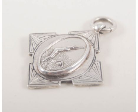 A sterling silver swizzle stick, engine turned and silver swimming medal, (2).