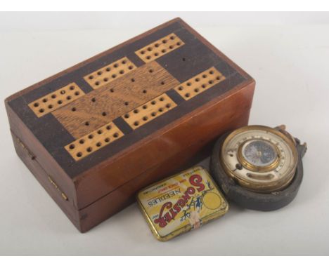 Set of brass pharmaceutical weights in a beechwood case, cribbage box, cribbage board, pocket barometer, and other items.