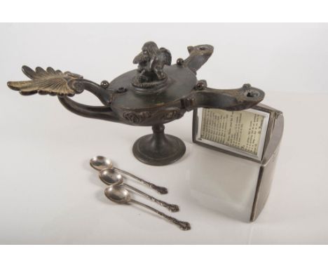 Folding pocket perpetual calendar, oil lamp, two silver napkin rings, six silver coffee spoons, one teaspoon.