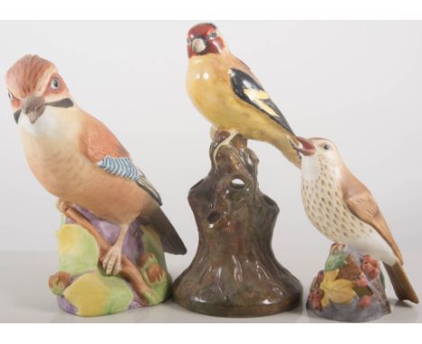 Two Royal Worcester porcelain models of Jays, 17cms, Royal Worcester model of a Goldfinch, and other Worcester bird models, (