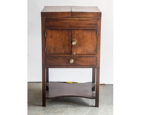 Late Georgian mahogany wash stand, hinged top above a cupboard, legs joined by a shelf, width 49cms.