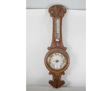 Aneroid barometer in oak case, height 66cm.