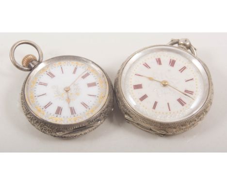 Four white metal fob watches and chain, a small top wind fob watch with pretty floral enamel dial in a silver case hallmarked