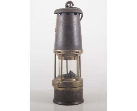 A Miner's lamp, GMEF, stamped Sheffield, height 29cms.