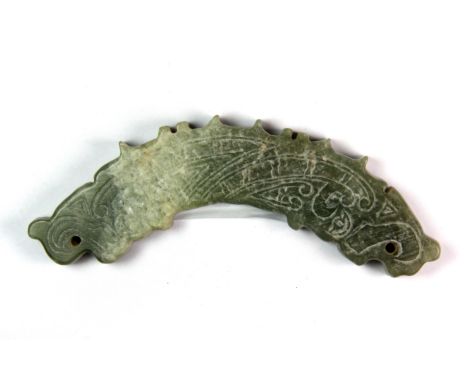 A Chinese Warring States style mixed colour jade pendant with engraved decoration, W. 11cm.