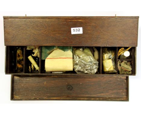 A box of polishing and wood working tools.