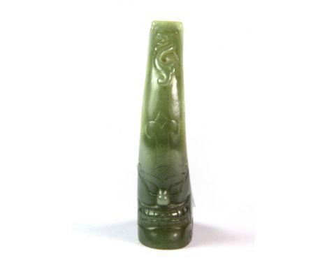 An unusual old Chinese celadon jade Mandarin hair decoration featuring a guardian face and a dragon, probably 19th century. H