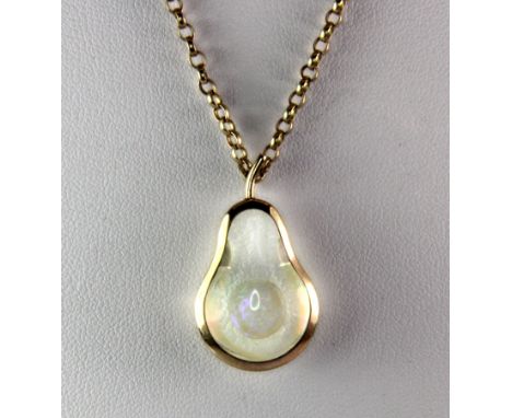 A 9ct yellow gold (stamped 9ct) pear shaped necklace set with a suspended opal (approx. 8.1gr).