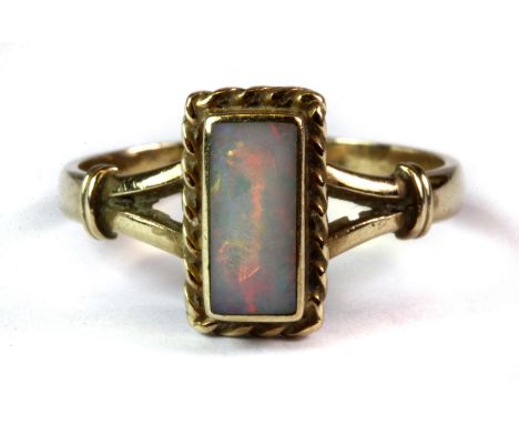 A yellow metal (tested 14ct gold) opal set ring (N.5).