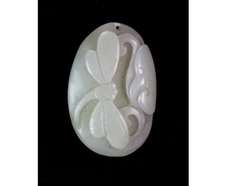 A small early 20th century Chinese carved pebble jade amulet of a dragonfly and lotus, H. 4cm.
