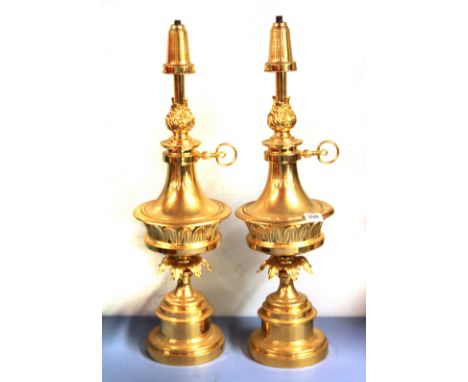 A pair of gilt metal table lamp bases, H. 69cm.
