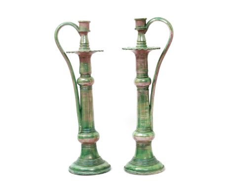 A pair of Wileman & Co Foley Faience chambersticks possibly designed by Walter Slater, tall, tapering cylindrical form with k