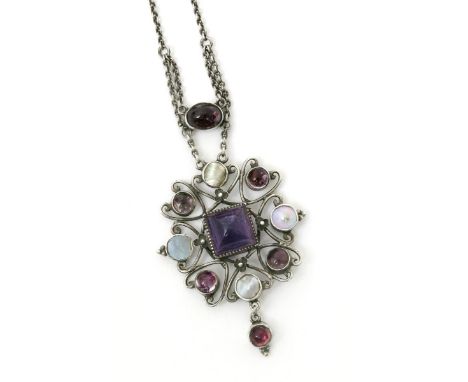 A wirework pendant necklace, set with central square amethyst stone, flanked with mother of pearl and garnet panels, with gar