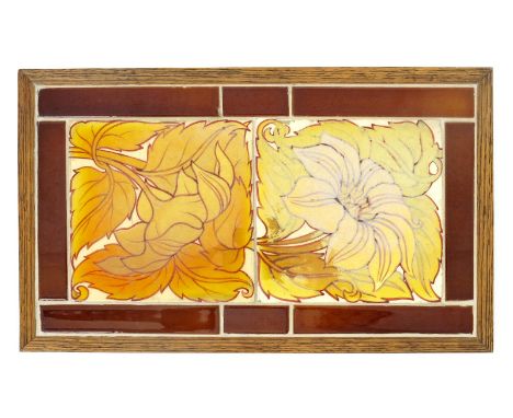 A pair of Maw & Co tiles, painted with flowers and foliage in a golden yellow and red design on cream, set inside brown space