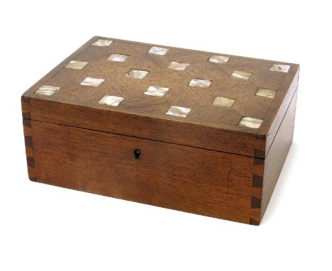 An English Walnut box and cover inlaid with mother of pearl probably by Ernest Gimson,  rectangular with hinged cover, dove-t