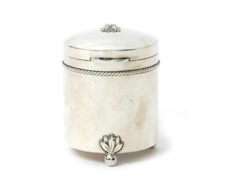 An A.E. Jones silver tea caddy and cover, cylindrical form,  with rope twist border, the hinged cover, slightly domed and cas