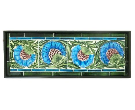 A William De Morgan BBB four tile panel. painted in shades of turquoise, aubergine and green on a white ground, inside turquo