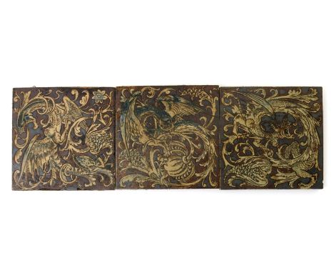 Three Martin Brothers stoneware tiles, each incised with a ferocious dragon amidst scrolling foliage, glazed in shades of bro